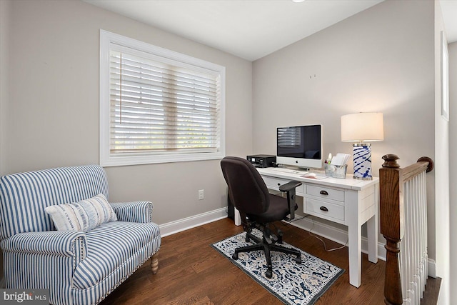 office space with wood finished floors and baseboards