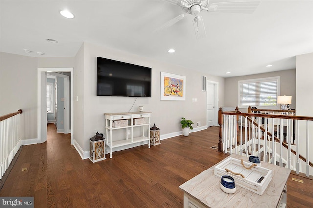 living area featuring recessed lighting, wood finished floors, baseboards, and ceiling fan