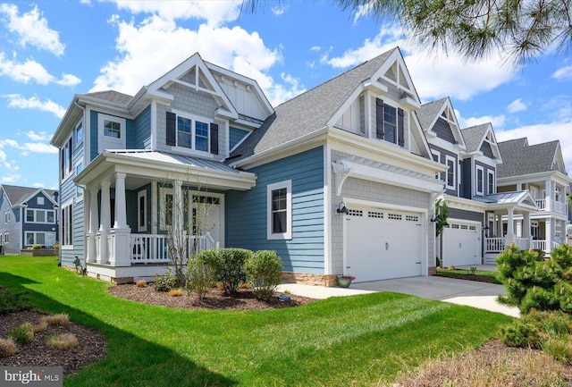 craftsman-style house with driveway, a porch, roof with shingles, a front yard, and a garage
