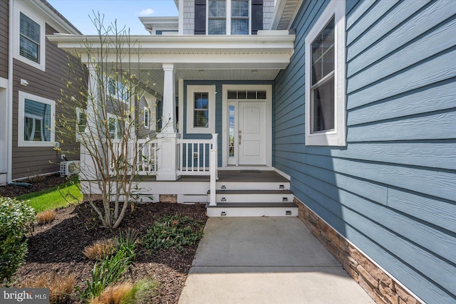 view of exterior entry featuring a porch