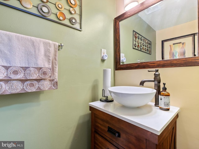 bathroom featuring visible vents and vanity