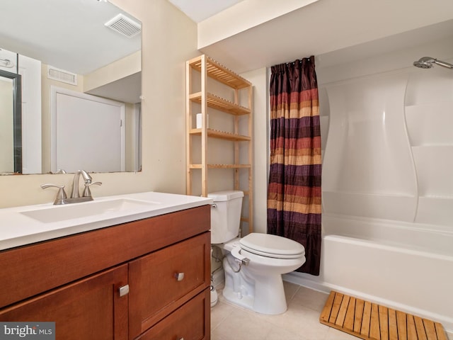 bathroom with toilet, tile patterned flooring, vanity, and visible vents
