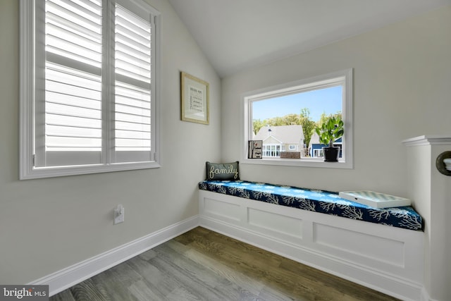 sitting room featuring baseboards, dark wood-style flooring, and vaulted ceiling