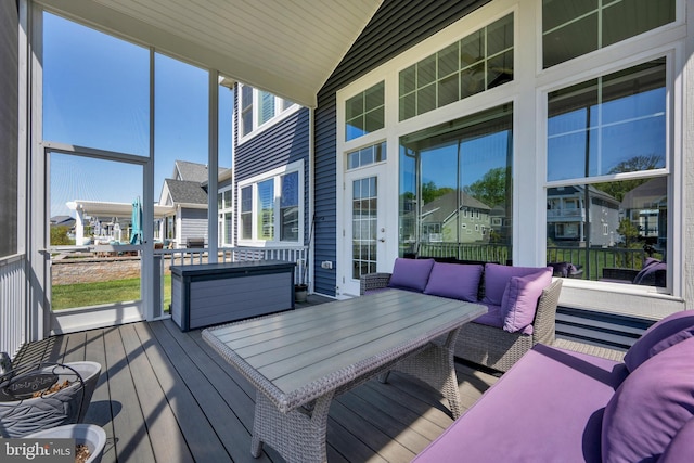 wooden terrace with outdoor dining space