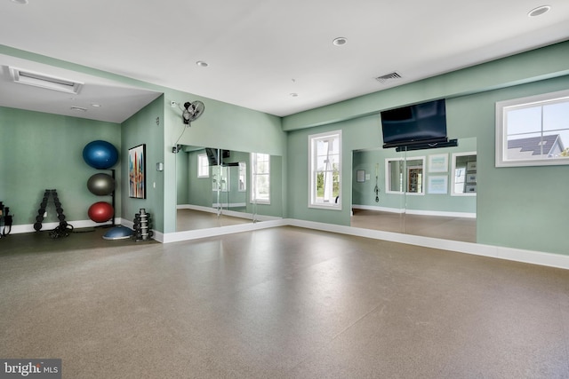 workout area featuring baseboards and visible vents