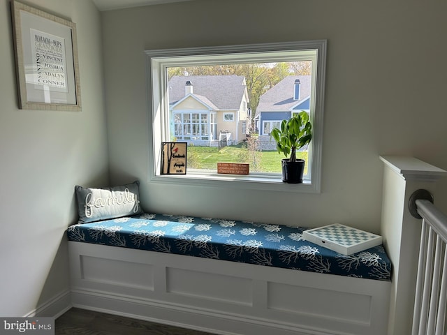 bedroom featuring baseboards and multiple windows