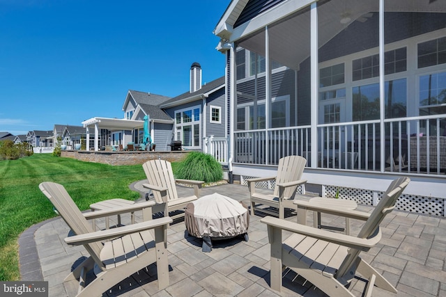 view of patio / terrace featuring an outdoor fire pit