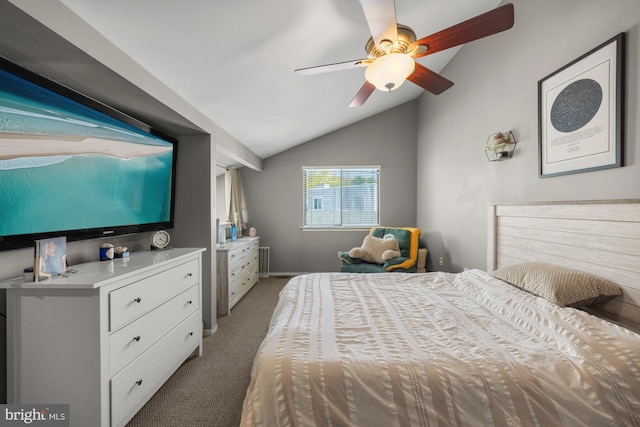 carpeted bedroom featuring ceiling fan and vaulted ceiling