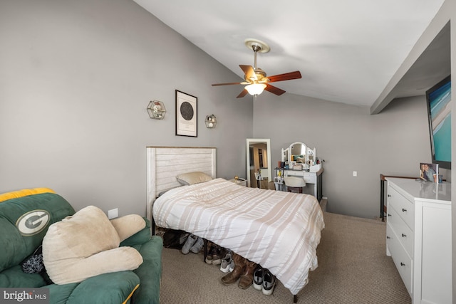 bedroom featuring light colored carpet, lofted ceiling, and a ceiling fan