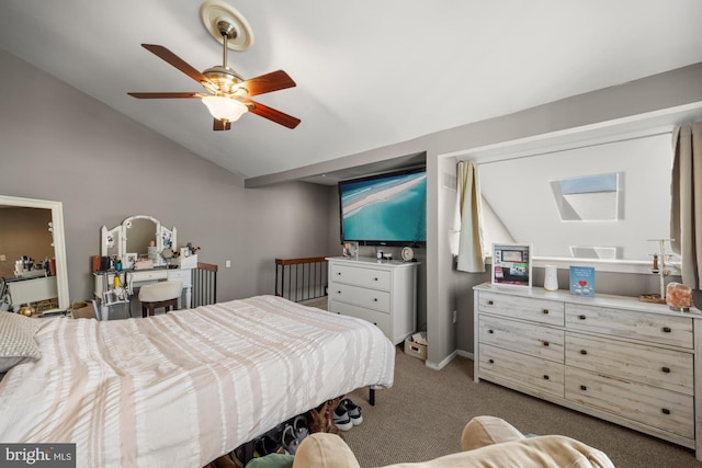 carpeted bedroom with visible vents, lofted ceiling with skylight, and ceiling fan