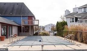 view of swimming pool featuring fence, a patio, and a fenced in pool