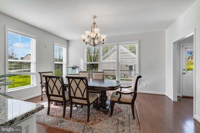 625 E G St, Purcellville, VA 20132 - dining room featuring baseboards, an inviting chandelier, and dark wood finished floors