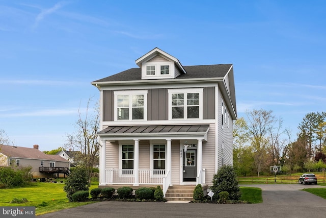 625 E G St, Purcellville, VA 20132 - traditional style home featuring metal roof, a standing seam roof, and covered porch