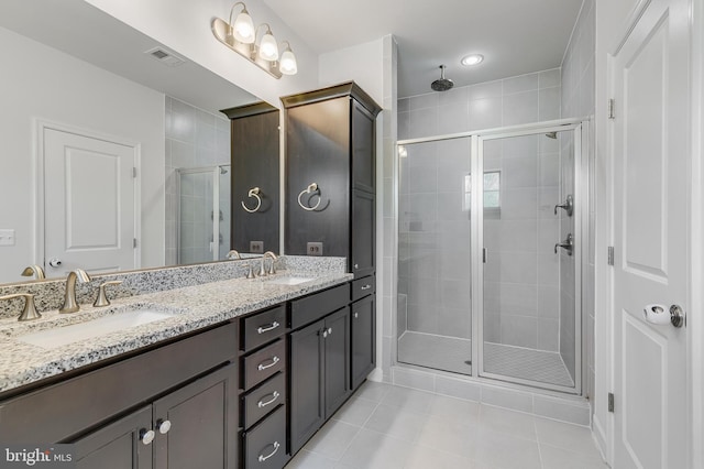 625 E G St, Purcellville, VA 20132 - bathroom featuring tile patterned floors, a sink, visible vents, and a stall shower