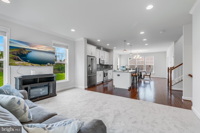 625 E G St, Purcellville, VA 20132 - living area with baseboards, recessed lighting, a chandelier, and ornamental molding