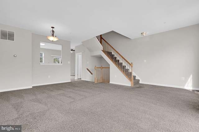 2475 Lakeside Dr, Frederick, MD 21702 - unfurnished living room with carpet, visible vents, baseboards, and stairway