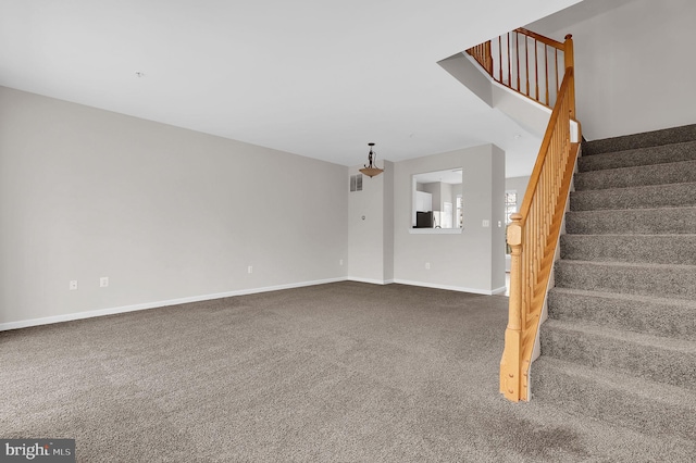 2475 Lakeside Dr, Frederick, MD 21702 - unfurnished living room featuring baseboards, carpet flooring, and stairs
