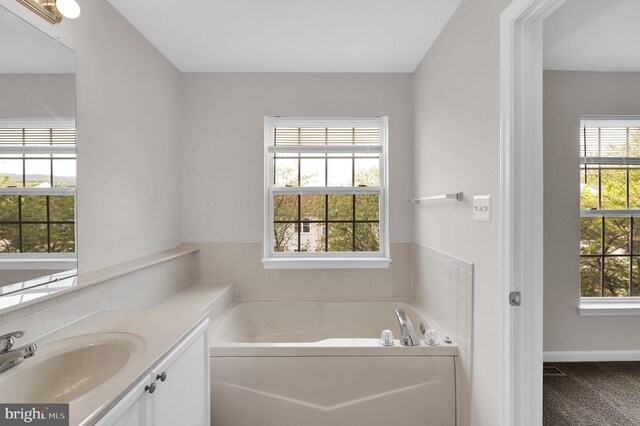 2475 Lakeside Dr, Frederick, MD 21702 - full bathroom with a garden tub, vanity, and a healthy amount of sunlight