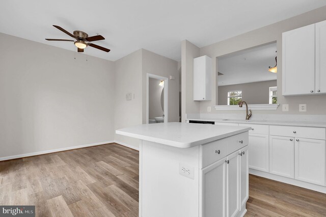 2475 Lakeside Dr, Frederick, MD 21702 - kitchen with a center island, a sink, light countertops, and light wood-style floors