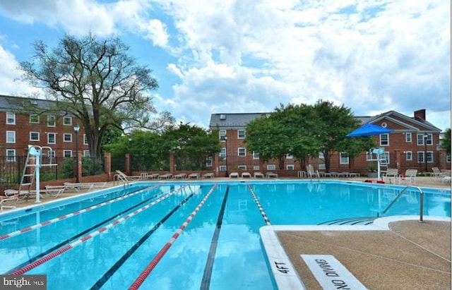 community pool featuring fence
