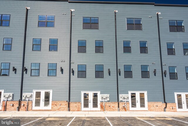 view of property featuring uncovered parking