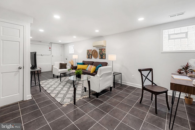 living area with visible vents, a wall mounted air conditioner, dark tile patterned floors, and recessed lighting