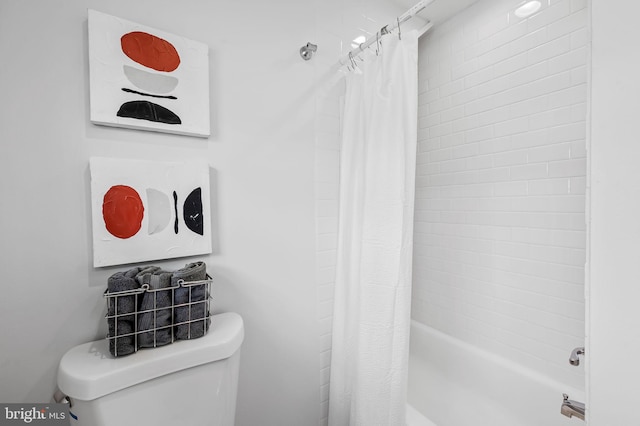 full bathroom featuring shower / tub combo and toilet