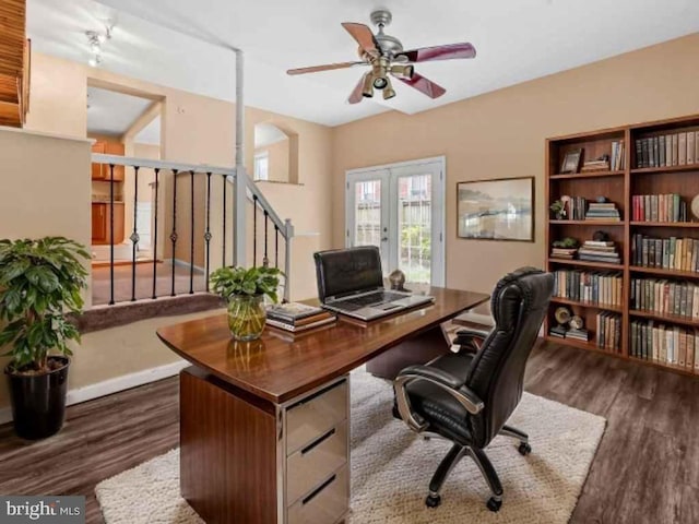 home office with ceiling fan, baseboards, dark wood-type flooring, and french doors