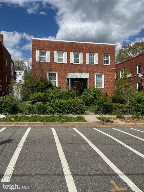 exterior space featuring uncovered parking