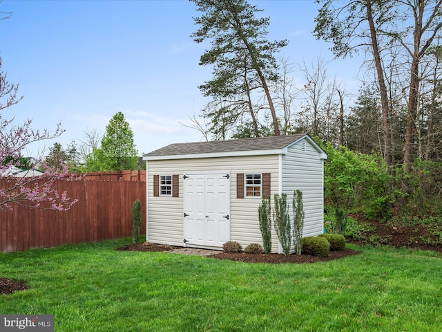 view of shed with fence
