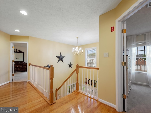 311 Clydesdale Dr, Stephens City, VA 22655 - hall with an upstairs landing, plenty of natural light, a chandelier, wood finished floors, and recessed lighting