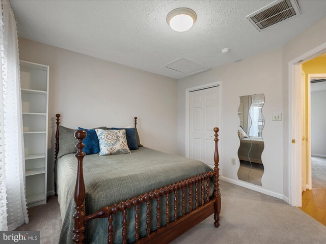 311 Clydesdale Dr, Stephens City, VA 22655 - carpeted bedroom with attic access, a textured ceiling, and baseboards