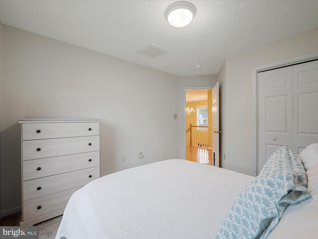 311 Clydesdale Dr, Stephens City, VA 22655 - bedroom featuring a closet, a textured ceiling, and carpet