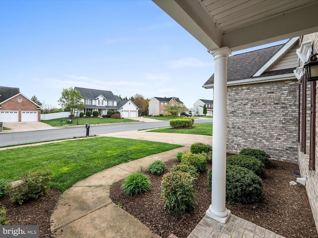 view of yard with a residential view