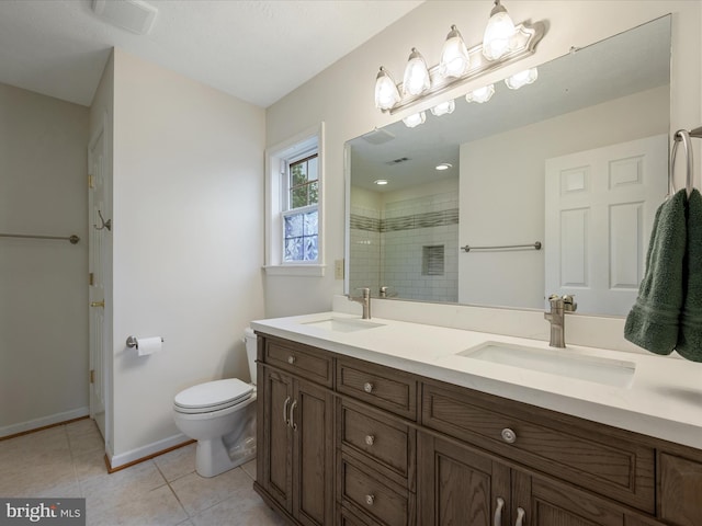 311 Clydesdale Dr, Stephens City, VA 22655 - bathroom featuring a shower stall, toilet, tile patterned flooring, double vanity, and baseboards