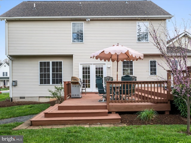 back of property with a deck