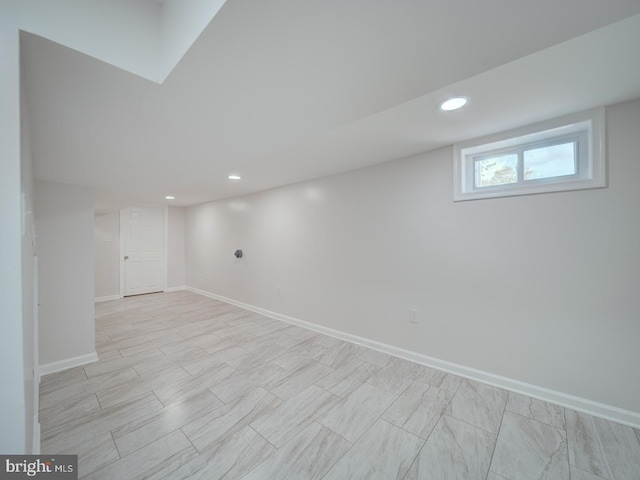 below grade area with recessed lighting and baseboards