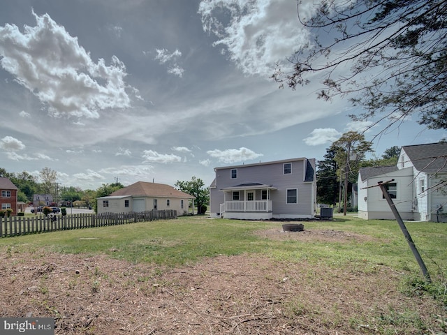 view of yard featuring a wooden deck, fence, and cooling unit
