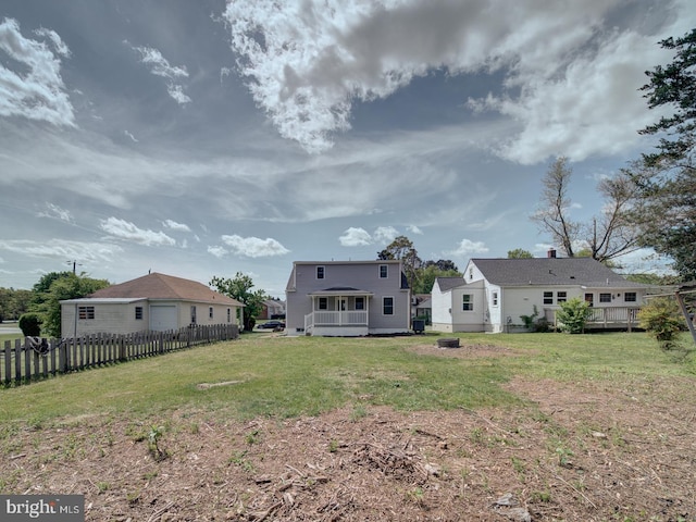 view of yard featuring a wooden deck and fence