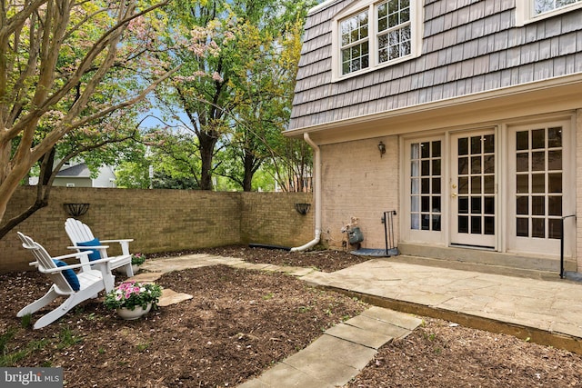 view of yard featuring a patio area and a fenced backyard