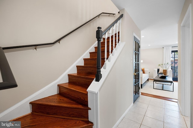stairs with recessed lighting, tile patterned flooring, and baseboards
