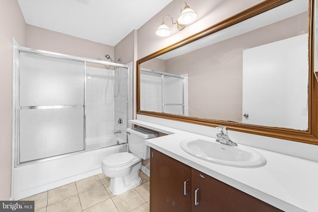21 Fisher Dr, Franklin Park, NJ 08823 - bathroom featuring tile patterned floors, toilet, vanity, and enclosed tub / shower combo