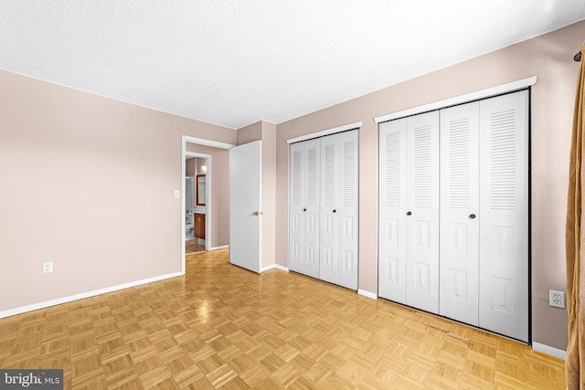 21 Fisher Dr, Franklin Park, NJ 08823 - unfurnished bedroom with baseboards and multiple closets