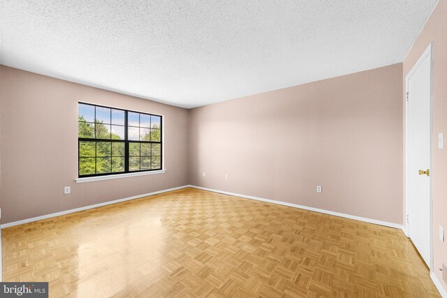 21 Fisher Dr, Franklin Park, NJ 08823 - spare room featuring a textured ceiling and baseboards