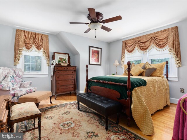 504 S Church St, Charles Town, WV 25414 - bedroom featuring wood finished floors, a ceiling fan, and multiple windows