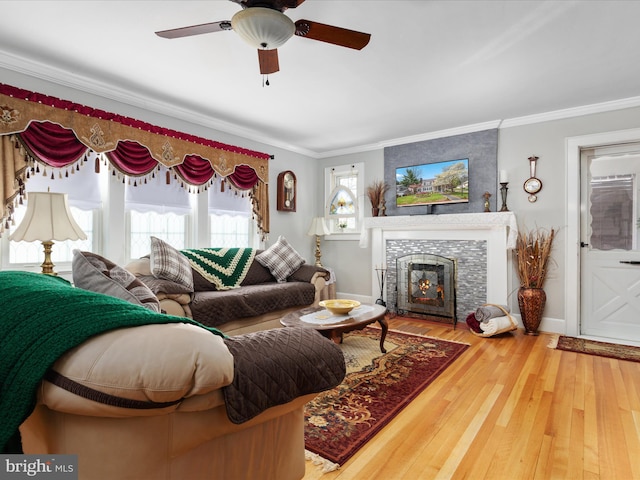 504 S Church St, Charles Town, WV 25414 - living room featuring baseboards, wood finished floors, ceiling fan, a fireplace, and ornamental molding
