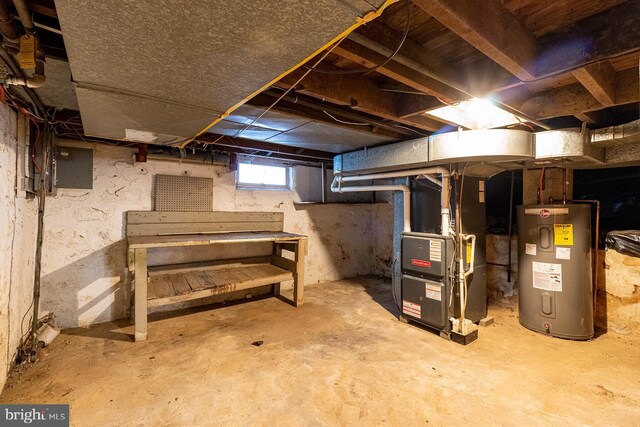 basement featuring water heater and heating unit