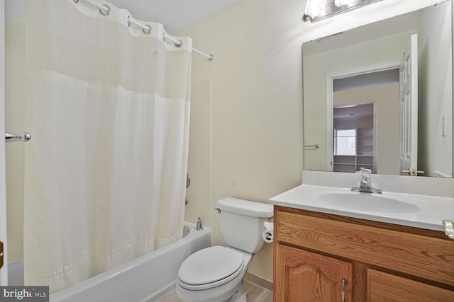 bathroom with vanity, toilet, shower / bath combo with shower curtain, and tile patterned floors
