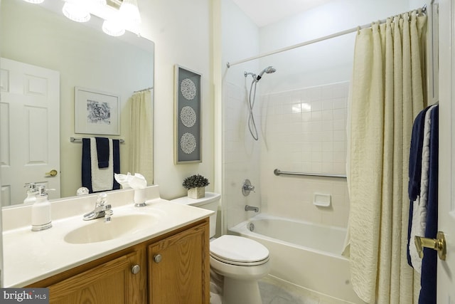 bathroom featuring shower / tub combo, toilet, vanity, and tile patterned flooring