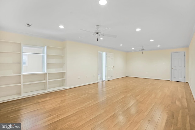 unfurnished room featuring a ceiling fan, light wood finished floors, recessed lighting, baseboards, and built in features